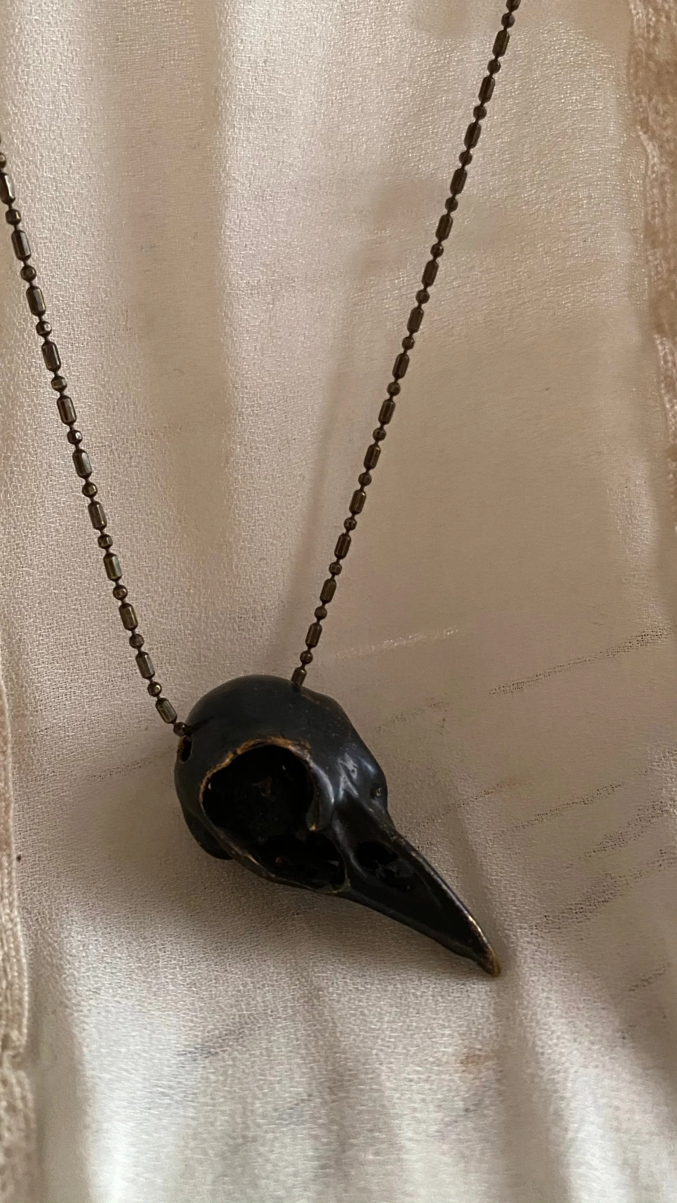 'Bird skull' necklace black | Bronze