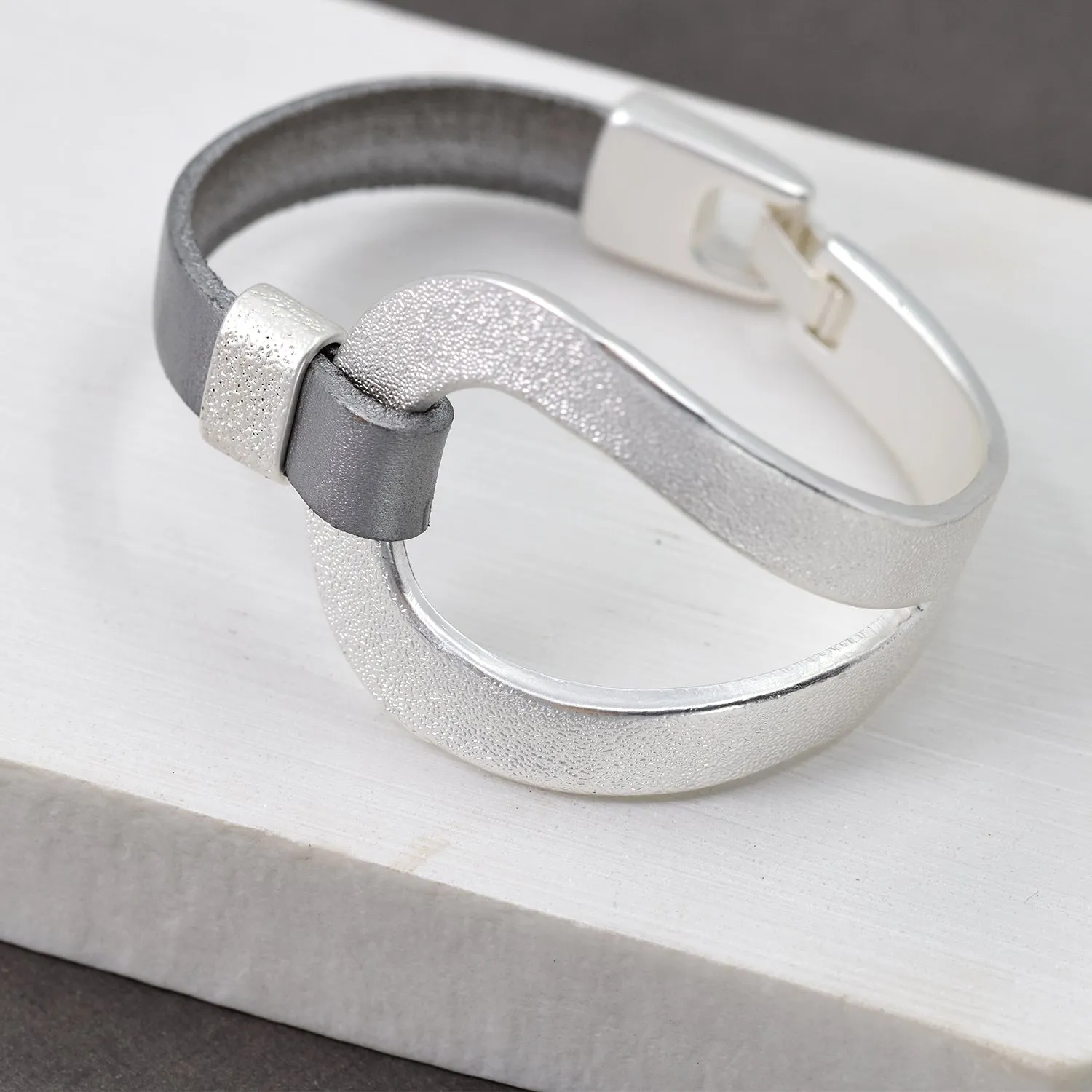 Leather bracelet with metal feature