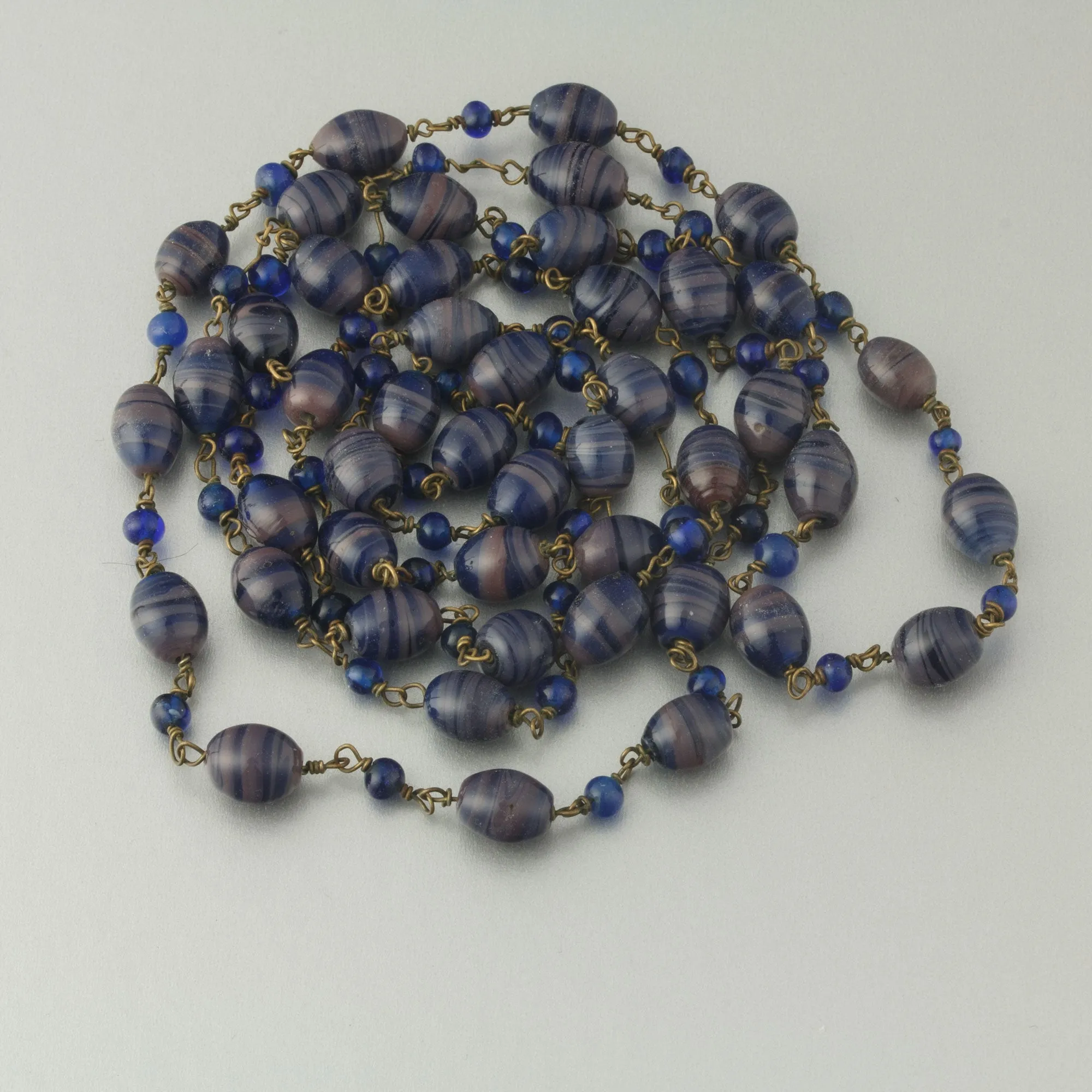 Necklace of wired handmade beads in bicolor swirls.  42". Czechoslovakia 1930s. j-nlbg2213